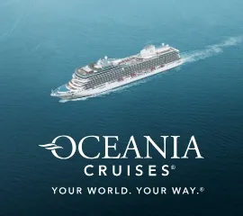 Die Oceania Vista auf hoher See mit dem Logo von Oceania Cruises.
