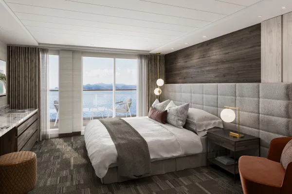 Das luxuriöse Penthouse der Norwegian Epic mit großen Panoramafenstern und einem gemütlichen Doppelbett.