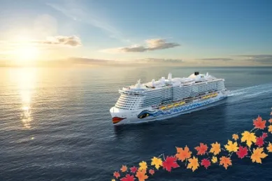 Außenansicht eines AIDA Schiffes auf dem Meer im Sonnenuntergang. In der rechten unteren Ecke ist eine Grafik mit goldenen und rotbraunen Herbstblättern zu sehen.