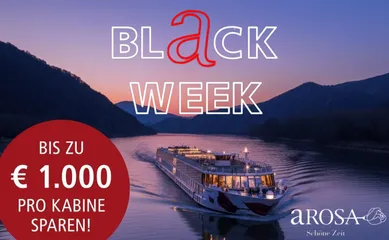 Black Week bei A-ROSA - bis zu 1.000 € sparen Hell erleuchtetes A-ROSA Schiff auf der Donau bei Nacht.