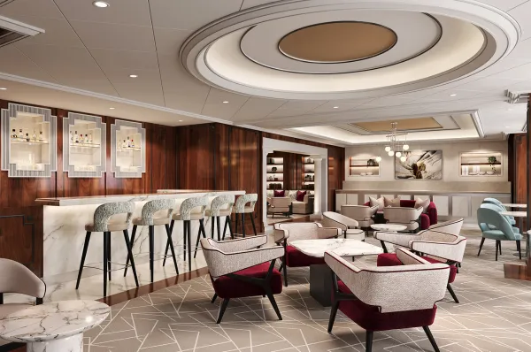 Die Retreat Lounge auf Celebrity Eclipse mit roten Akzenten und genug Sitzmöglichkeiten, dass jeder ein nettes Plätzchen findet.
