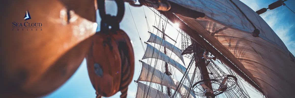 Sea Cloud Cruises Segelkreuzfahrt buchen Die Segel eines SEA CLOUD Schiffes durch Taue und Seile fotografiert.
